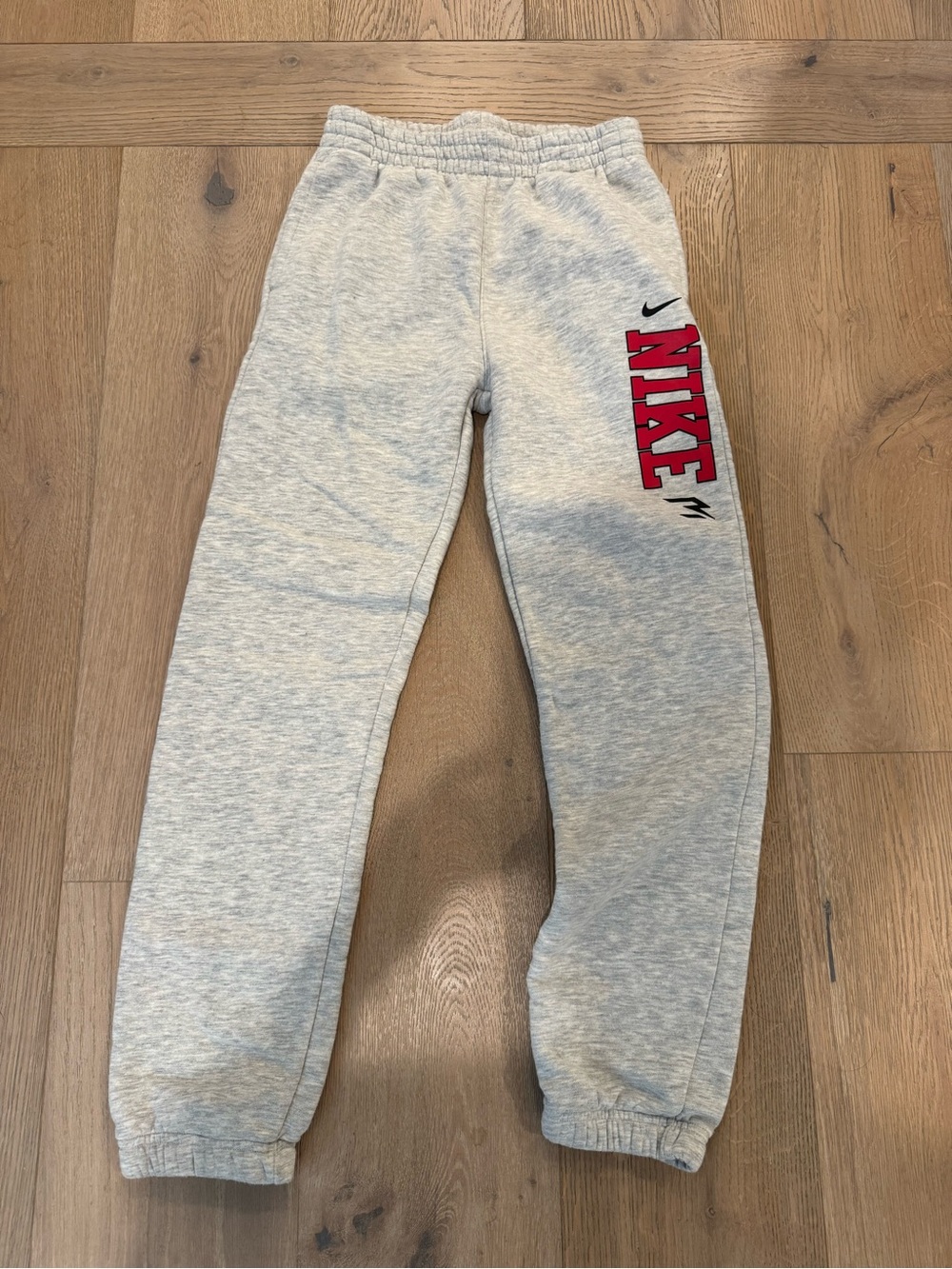 Nike Gray Kids Sweatpants with Red Side Logo